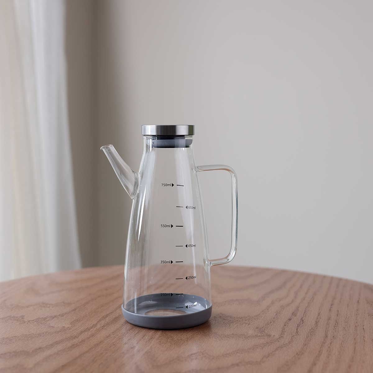 Conical oil jug with graduated scale