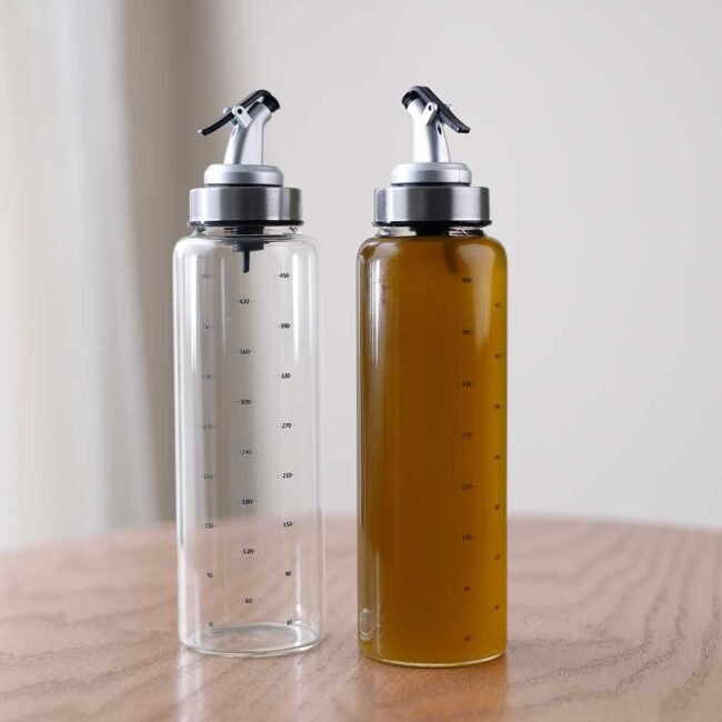 Cylindrical oil bottle with small nozzle - Image 2