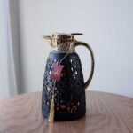 golden decorated thermos